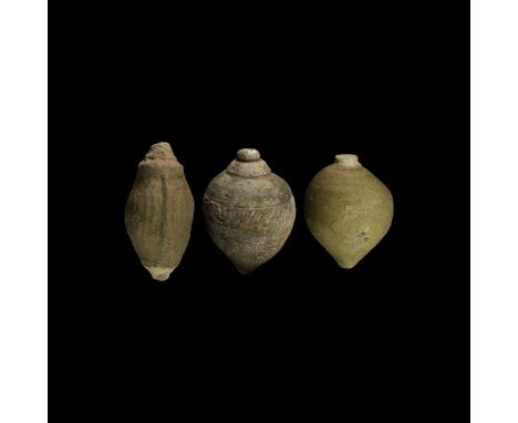 9th-11th century AD. A group of three hollow ceramic vessels each with conical body, intended to be filled with explosive liq