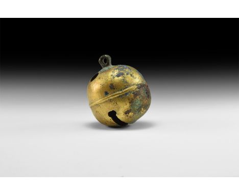 18th century AD. A large gilt-bronze crotal bell with rib to the centre, opening to the base, small suspension ring to the to