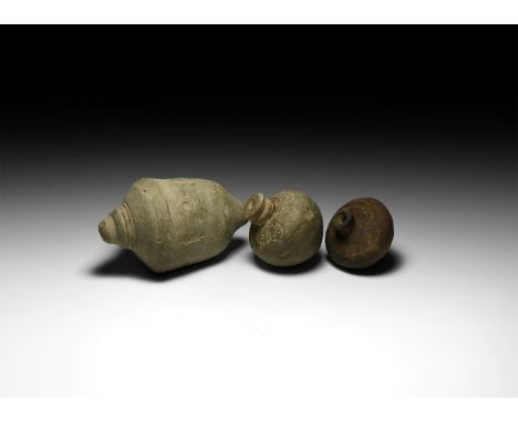 9th-11th century AD. A group of three hollow ceramic vessels two with conical body, one with piriform body, intended to be fi