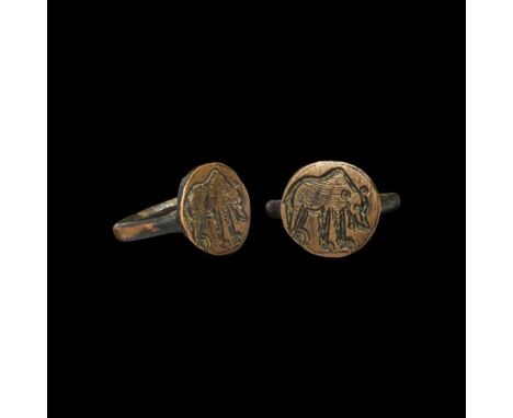 15th-16th century AD. A West European bronze ring with round-section hoop, discoid plaque bezel with a standing bear.   5.12 