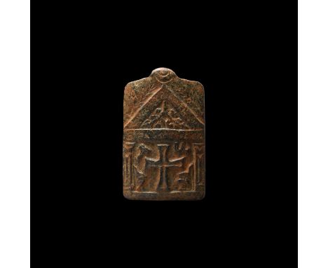 6th-8th century AD. A carved schist rectangular pendant with suspension loop, upper panel with chevron and epigraphic legend,