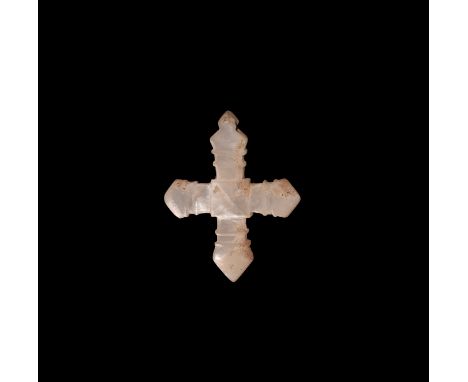 19th century AD. A nacre expanding-arm cross pendant with raised line decoration to each arm, Greek cross in the centre panel