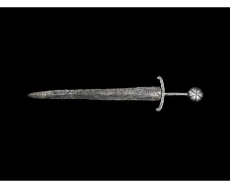 13th-14th century AD. An iron two-edged dagger with lentoid-section tapering blade, quillons with scrolled ends, narrow tang,