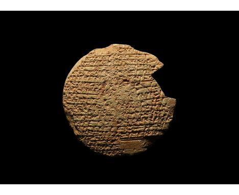 20th-19th century BC. A large ceramic nail-head with two columns of tight Sumerian cuneiform text dealing with the rebuilding