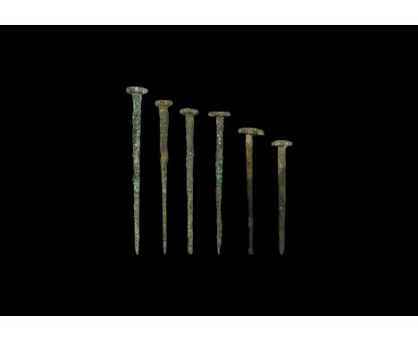 Late 3rd millennium BC. A mixed group of bronze dress pins, each with tapering shank and rosette finial, including two accomp