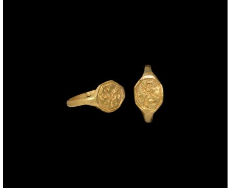 Circa 1580 AD. A gold finger ring with octagonal bezel, pelleted border enclosing a griffin rampant; maker's mark to the reve