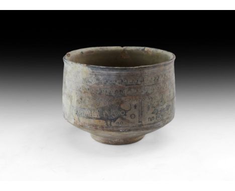 3rd-2nd millennium BC. A ceramic footed bowl with painted frieze including a bird, bulls and other animals, geometric frames.
