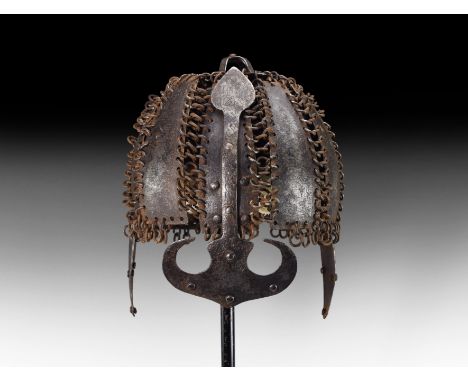 18th-19th century AD. A segmented iron helmet comprising ten trapezoidal iron panels linked to each other with thick butted m