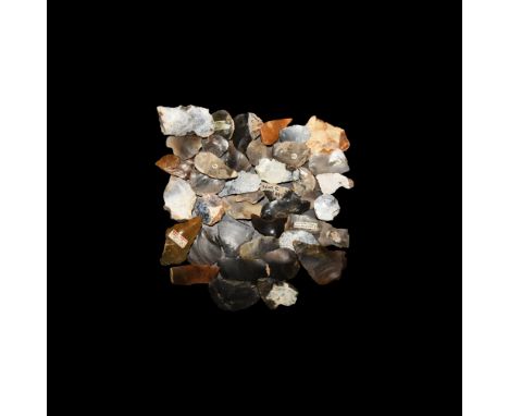Mainly Mesolithic, 12,000-5,000 BC. A mixed group of knapped flint scrapers, burins and other tools, many with inked notation