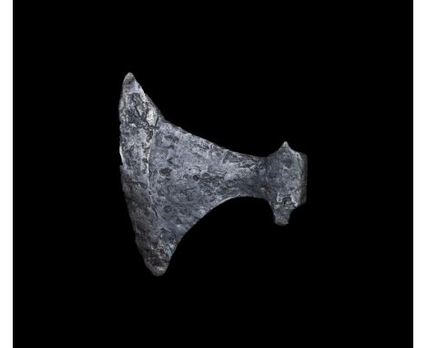 9th-11th century AD. An iron axe with wide curved blade and reinforced curved cutting edge; triangular-section socket with fl