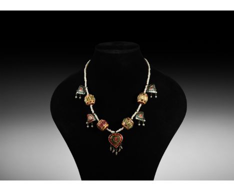 20th century AD. A strung, reversible pearl necklace composed of four large gold beads with rose and cream enamel, inlaid wit