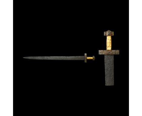 5th-6th century AD. An iron two-edged sword with lentoid-section blade, the blade with battle nicks to both cutting edges and