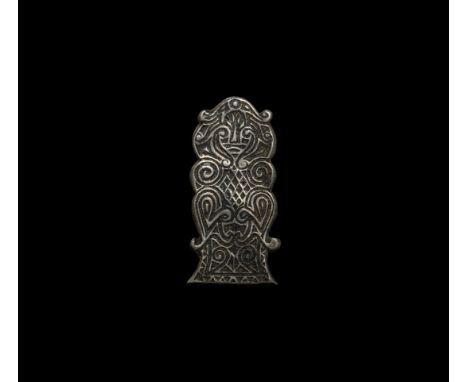 9th-11th century AD. An exceptional silver belt plate with a standing bearded figure, possibly Odin, with two ravens flanking