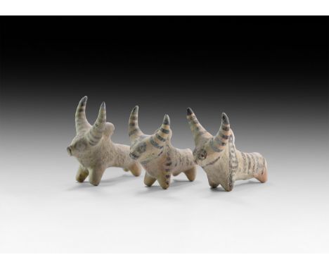 4th-2nd millennium BC. A group of three ceramic zebu figures with painted linear detailing.   246 grams total, 82-88m (3 1/4 