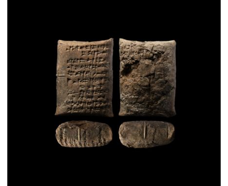 18th-16th century BC. An unopened ceramic pillow-shaped envelope with enclosed tablet, the envelope with impressed cuneiform 