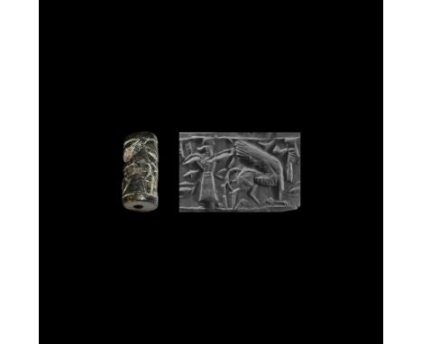 2nd millennium BC. A schist cylinder seal with intaglio frieze of a huntsman with bow, arrow and quiver, aiming at a winged g
