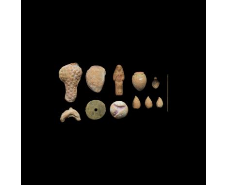 2nd millennium BC and later. A mixed group of ceramic items including a bird-shaped weight; replica fruit; a spindle whorl; a