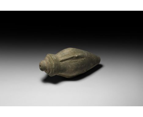 9th-11th century AD. A hollow ceramic piriform missile with conical top and thick rim enclosing the narrow mouth, concentric 