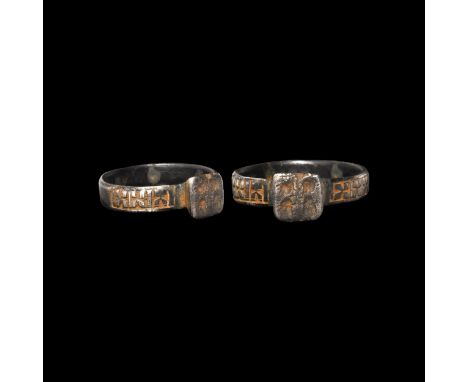 6th-7th century AD. A silver ring with flat-section hoop, panels of X-motifs to the shoulders, raised rectangular bezel with 