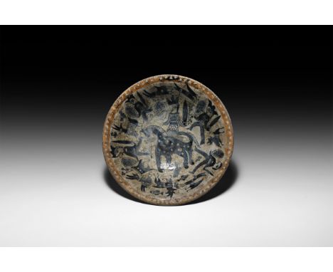 20th century AD or earlier. A glazed ceramic dish depicting internally a central figure with sword and shield on horseback, t