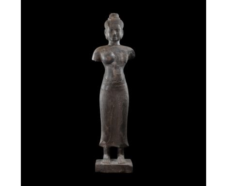 12th-13th century AD. A standing figure of Prajnaparamita in black granite with ribbed sanghati to hips, the hair gathered ti