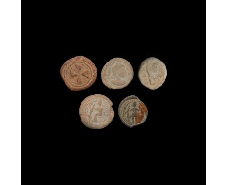 Mainly later 1st millennium BC. A mixed group of ceramic tokens with designs including portrait bust, seated figure with dog,
