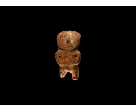 1st millennium AD. A ceramic figure with large disc head, pinched nose, holes to the arms, applied bands to the face, neck an