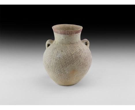 3rd-2nd millennium BC. A ceramic bulbous vessel with everted neck and flat base, loop handles to the shoulders, painted retic