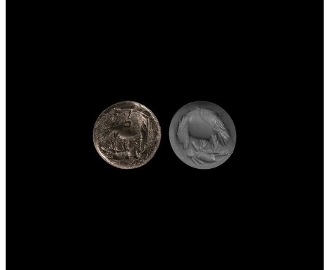 2nd-3rd century AD. A round silver intaglio engraved with an eagle attacking a rabbit.   1.78 grams, 12.53mm (1/2"). From the
