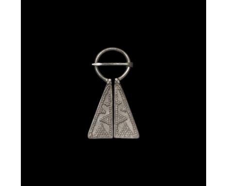 12th-14th century AD. A Viking inspired silver omega brooch with geometric faux granule decoration to both flanges. See Sedov