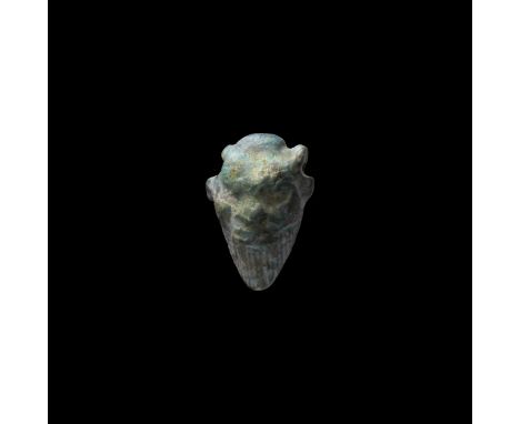 Late Period, 664-332 BC. A green glazed composition bead pendant representing bearded mask of a satyr.   1.76 grams, 19mm (3/