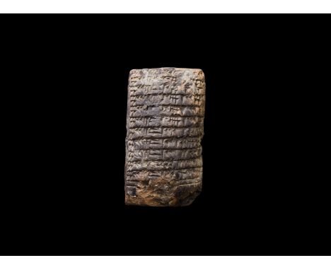 20th-18th century BC. A ceramic pillow-shaped tablet with dense cuneiform writing containing multiplication tables to both si