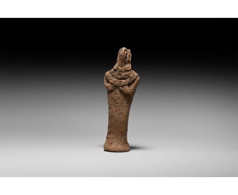 12th-7th century BC. A ceramic figurine with applied lappet headdress and triple necklace, hands raised below the necklace, p