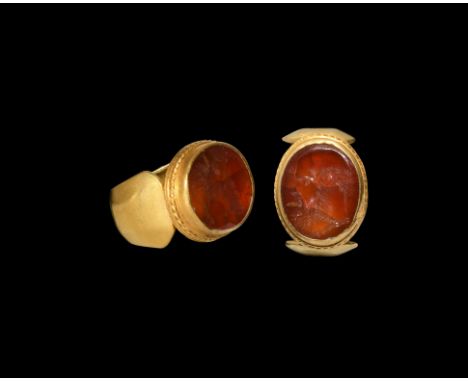 2nd-3rd century AD. An ellipsoid carnelian cloison with intaglio profile portrait of a balding, bearded male, possibly Silenu