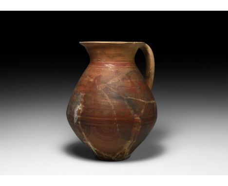 3rd-2nd century BC. A ceramic vessel with biconical body, strap handle and trumpet rim; body decorated with red painted scene