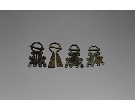 12th-14th century AD. A group of four bronze Viking inspired omega brooches comprising: one with faux granule detail to both 