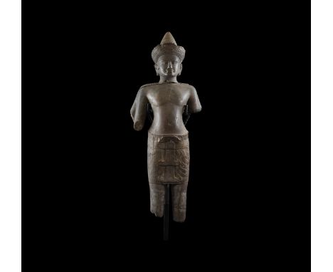 11th-13th century AD. A polished stone standing male deity, probably Vishnu, with four arms, face with linear ridge forming a