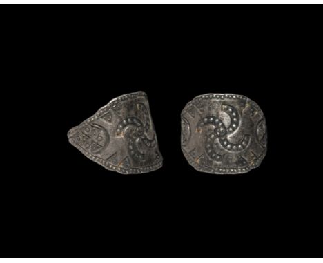10th-12th century AD. A sheet silver finger ring with central fylfot motif and stamped pellet and triangle ornaments; the end