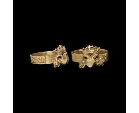 17th-18th century AD. A silver-gilt ring with applied cast openwork bezel, heart within an arc with shamrock(?) finials and c