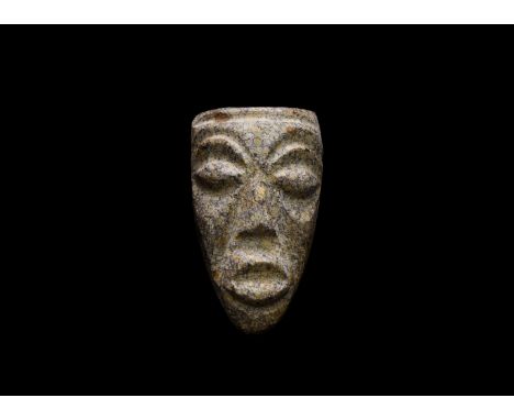 Pliocene Period, 5.2-2.5 million years BP. A mastodon fossil bone with later carving depicting a face.   105 grams, 86mm (3 1
