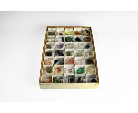 A collection of thirty-five mineral specimens in card trays with labels indicating place of origin and other data; comprising