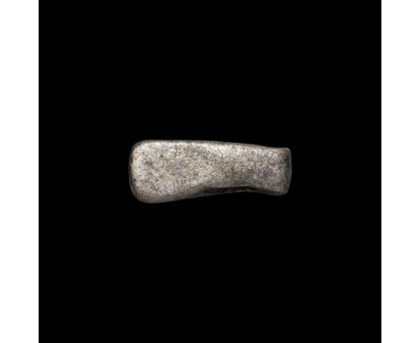 9th-11th century AD. A silver pendant formed as an axe with rectangular extension to the rear; pierced through the socket for
