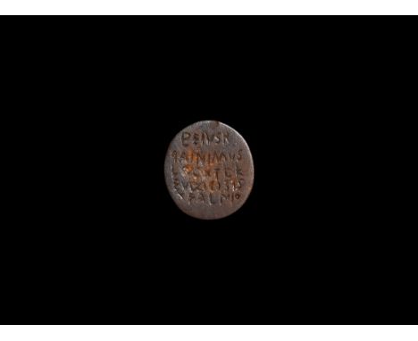 5th-7th century AD. A fossil bone disc with incised Gnostic text in Greek script.   2.38 grams, 20mm (3/4"). From a private B