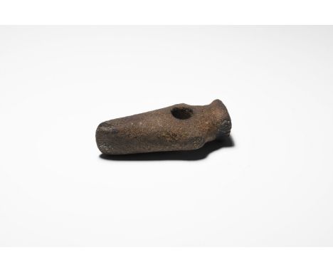 Neolithic, 3rd-2nd millennium BC. A ground stone axe hammer with slightly convex cutting edge tapering gently to shoulders an