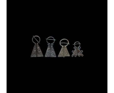 12th-14th century AD. A group of four bronze Viking inspired omega brooches comprising: three with faux granule geometric det