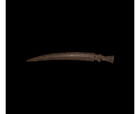16th-18th century AD. A hand-forged iron single-edged knife with T-section blade, curved back and reinforcing rib, integral s