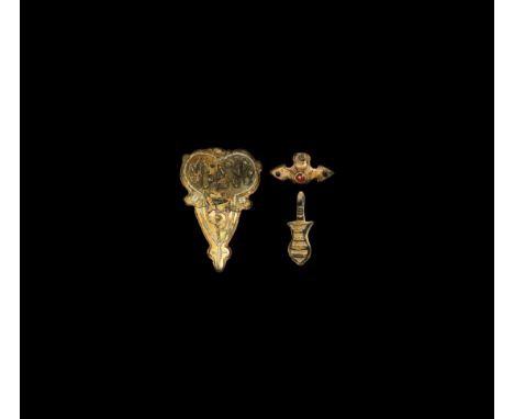 15th century AD. A mixed gilt-bronze group comprising: a leaf-shaped plaque with white enamel inlay; a small pyramidal stud o