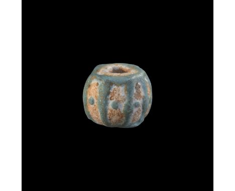1st-3rd century AD. A large white glass bead with turquoise trailed cage-decoration, pellet to each panel.   9.4 grams, 24mm 