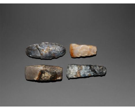 Neolithic, 3rd-2nd millennium BC. A group comprising: thick-butted polished flint axe with squared butt; another similar exam