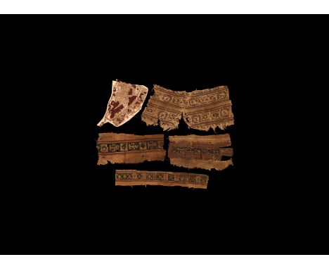 3rd-6th century AD. A mixed group of decorative textile panels comprising: a border of geometric polychrome motifs; one simil